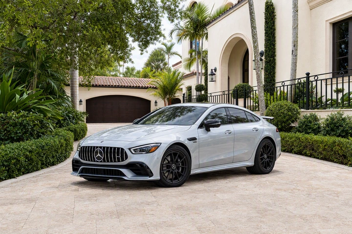 Silver four-door Mercedes-AMG GT 43, viewed from the front and side